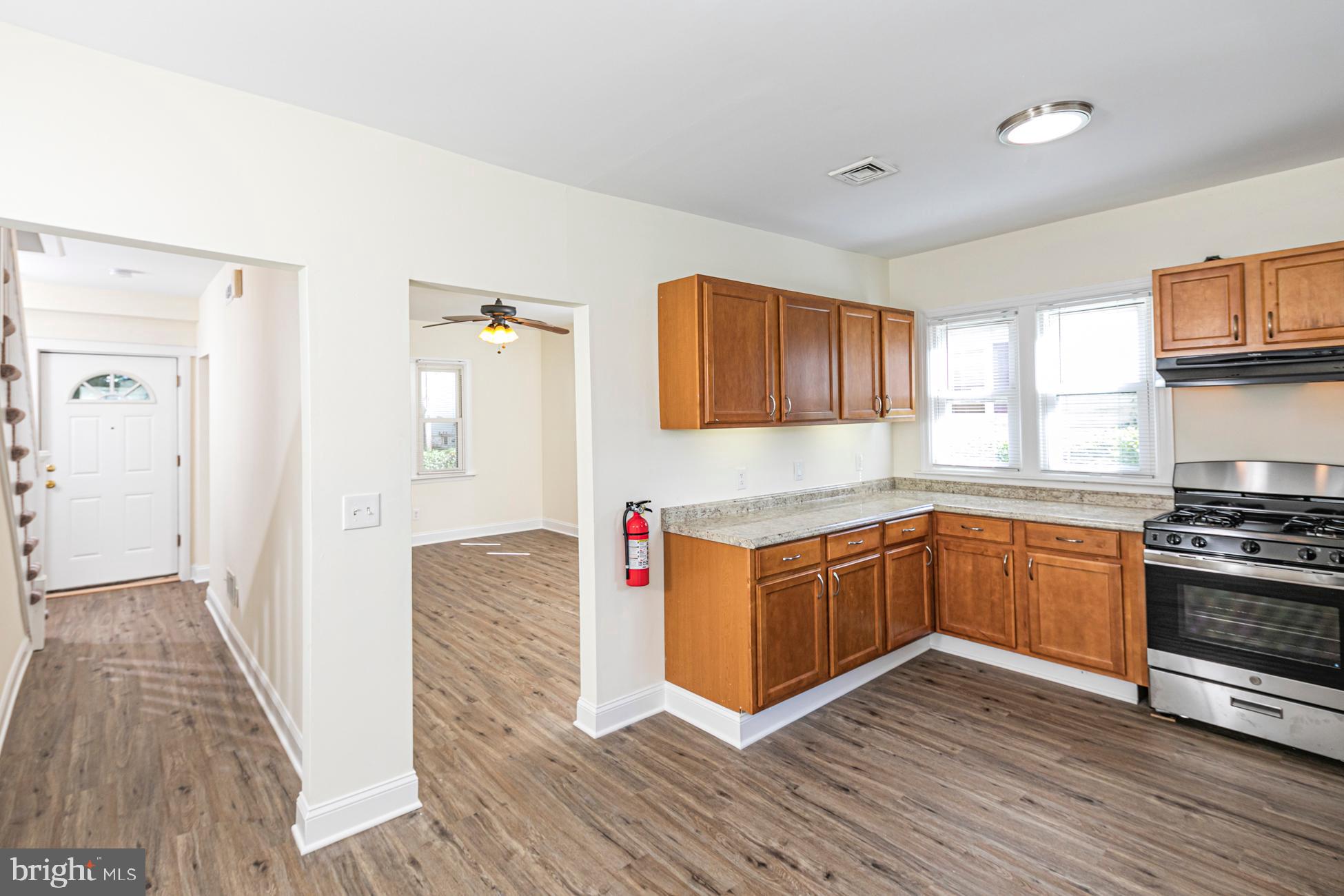 166 John Street Princeton, NJ 08540 - Photo 6 of 29 a kitchen with stainless steel appliances granite countertop a stove a sink and a refrigerator