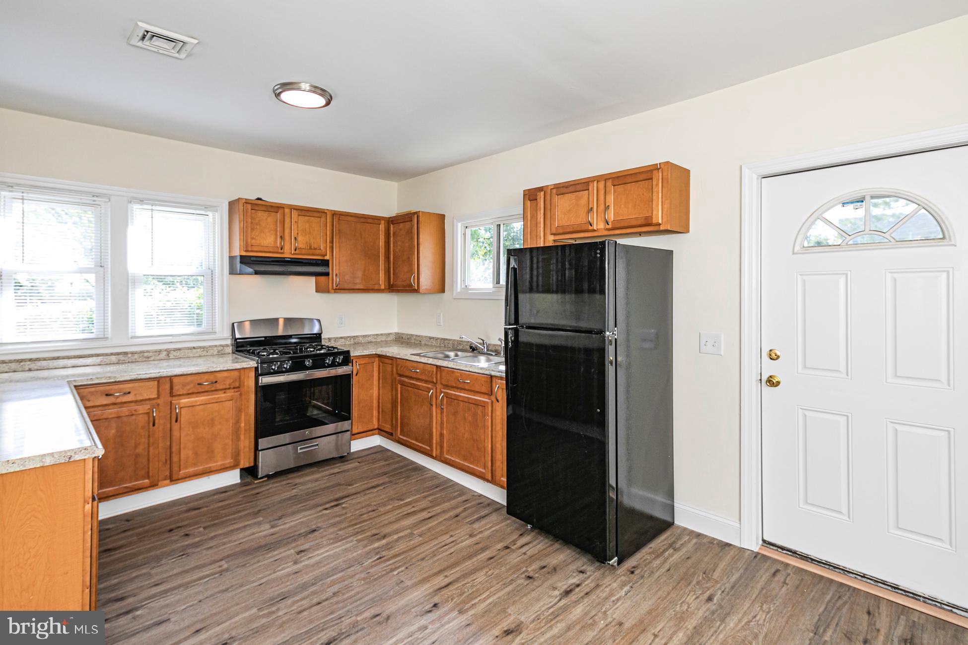 166 John Street Princeton, NJ 08540 - Photo 8 of 29 a kitchen with stainless steel appliances granite countertop a refrigerator stove and sink