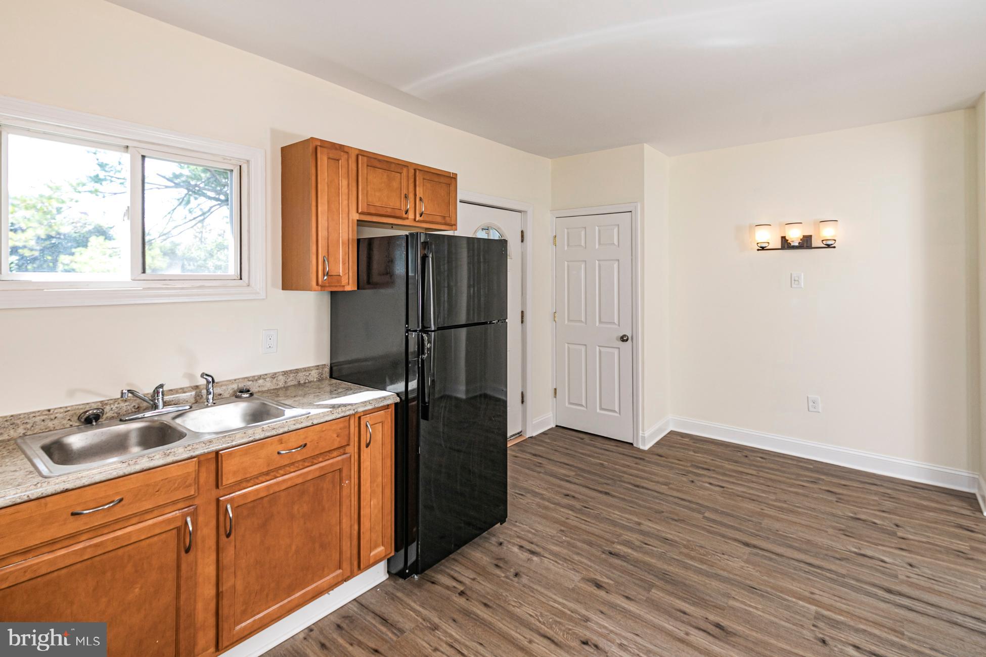 166 John Street Princeton, NJ 08540 - Photo 9 of 29 a kitchen with a refrigerator and window