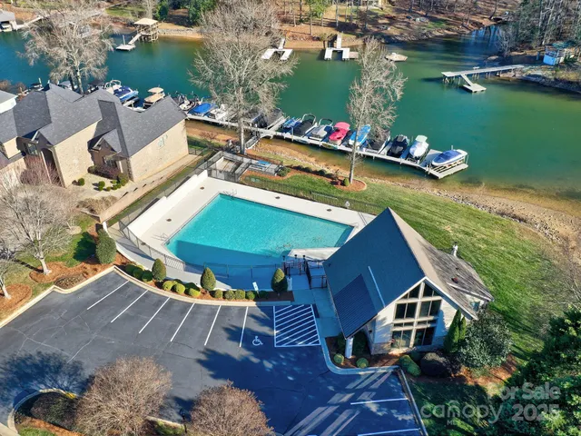 an aerial view of a house a yard and outdoor seating