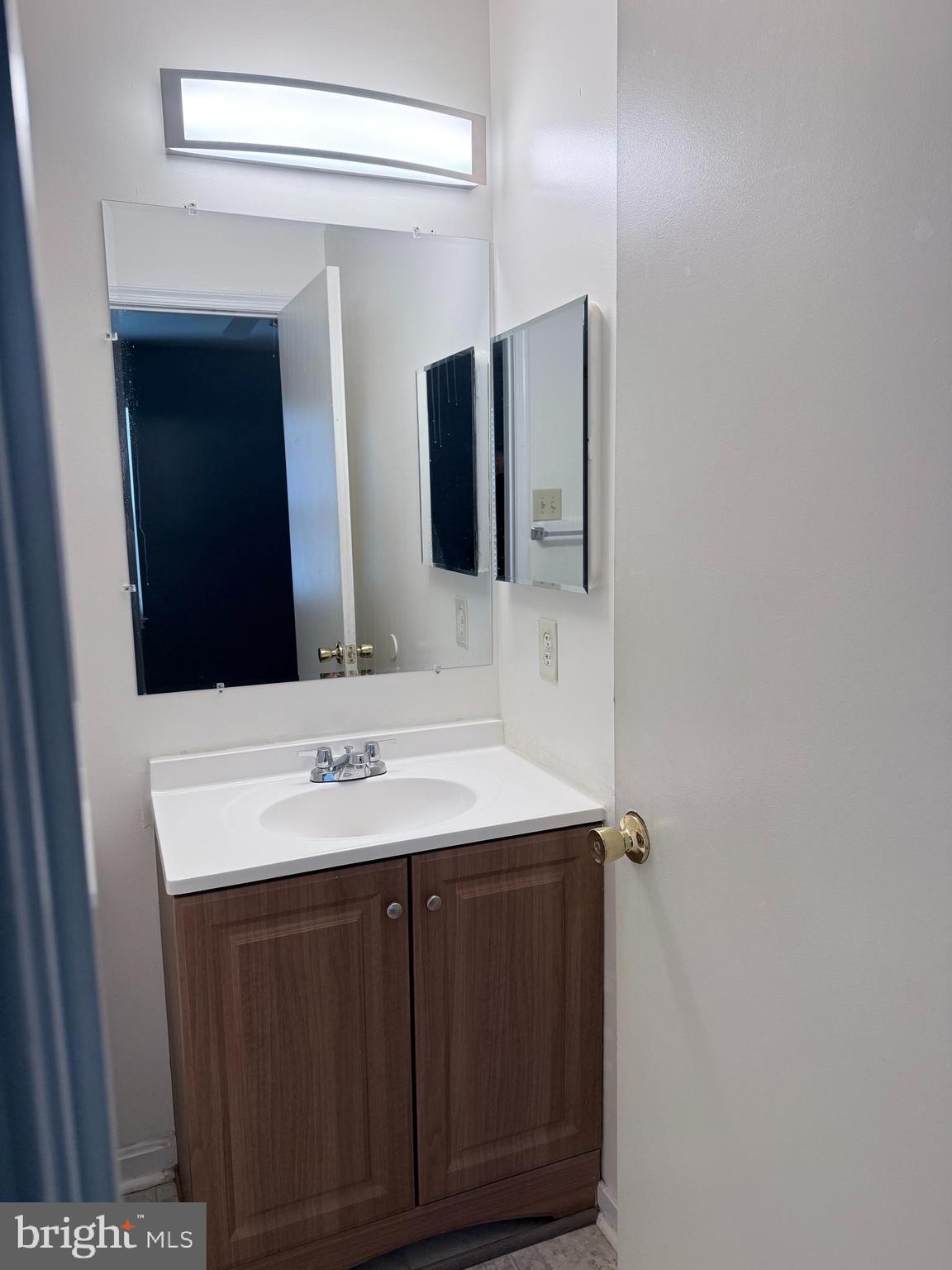 8573 Ritchboro Road District Heights, MD 20747 - Photo 12 of 19 a bathroom with a sink and a mirror