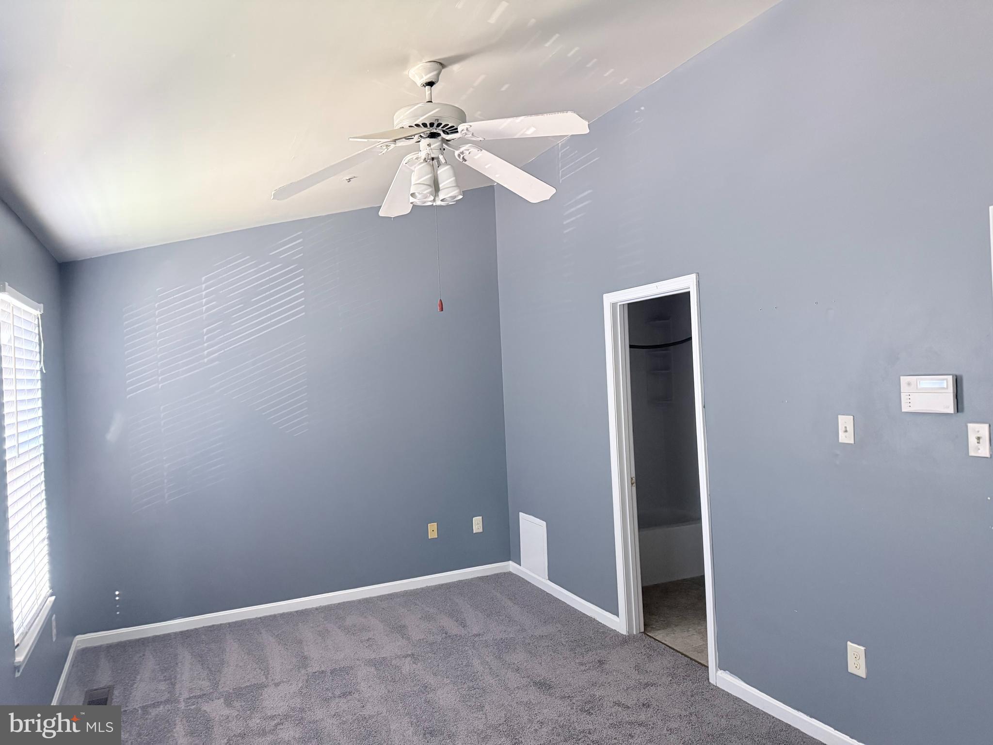 8573 Ritchboro Road District Heights, MD 20747 - Photo 9 of 19 an empty room with windows and fan