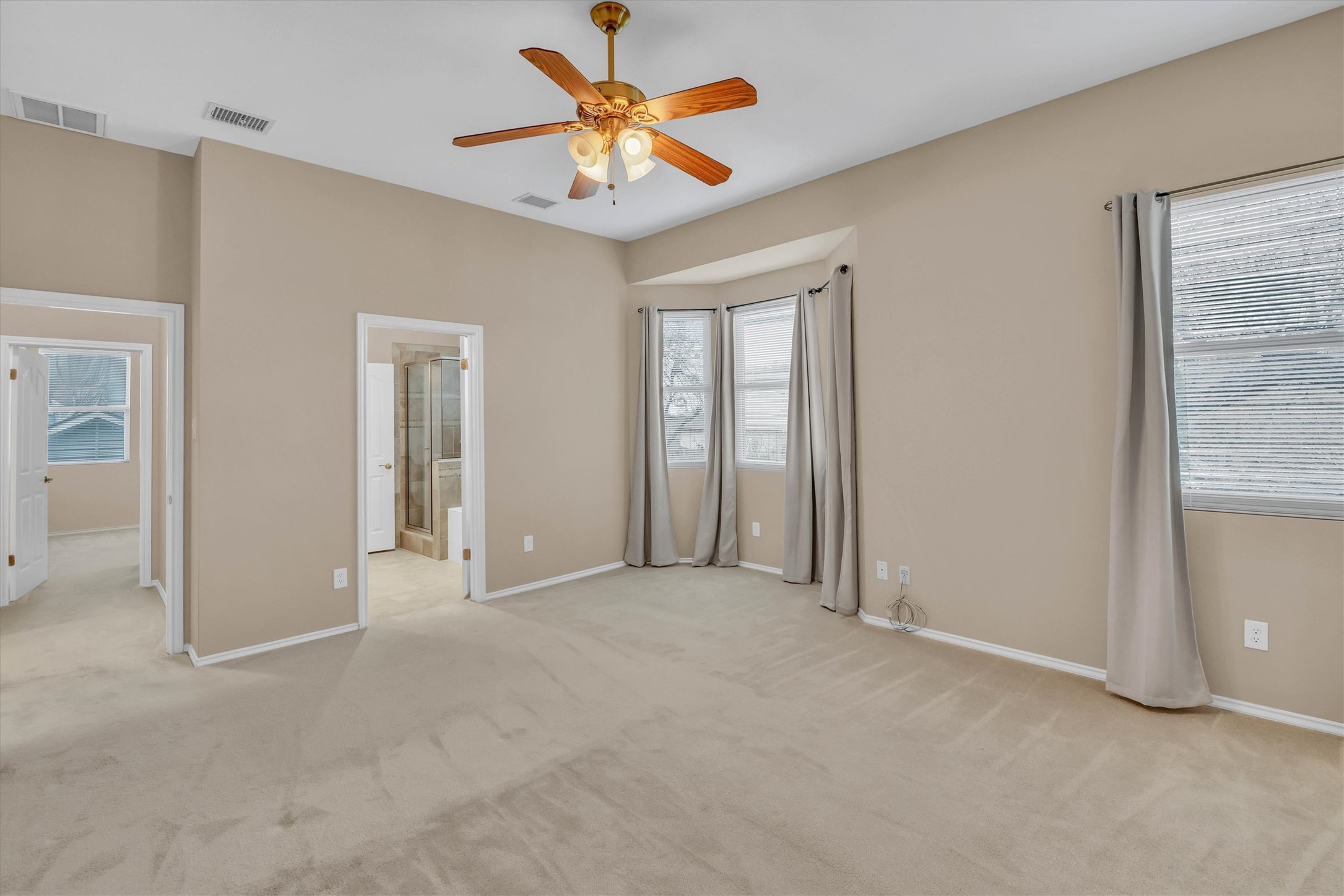 8108 Matchlock Cove Austin, TX 78729 - Photo 25 of 40 Unfurnished bedroom featuring ceiling fan and light colored carpet