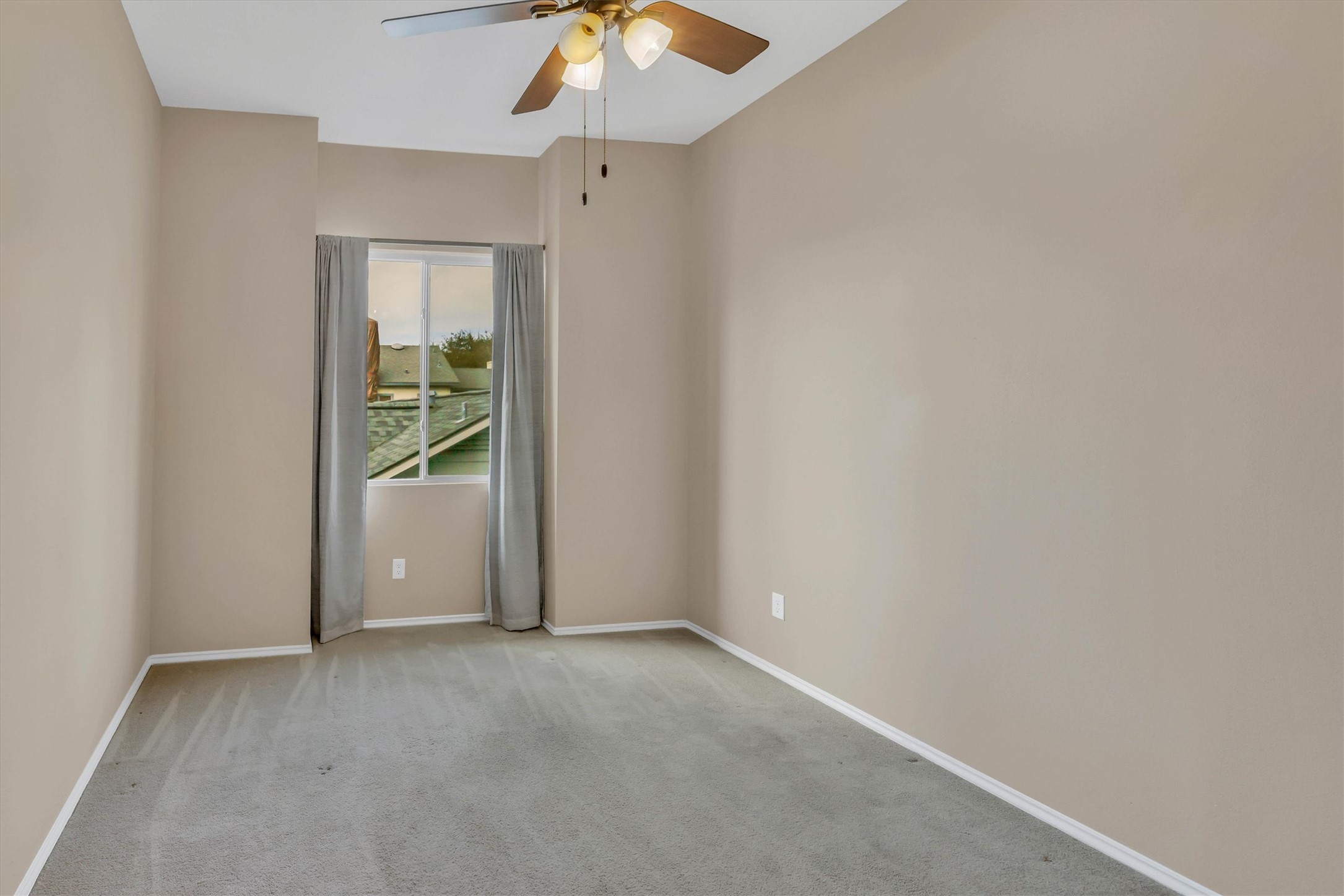 8108 Matchlock Cove Austin, TX 78729 - Photo 32 of 40 Carpeted spare room featuring a ceiling fan and baseboards