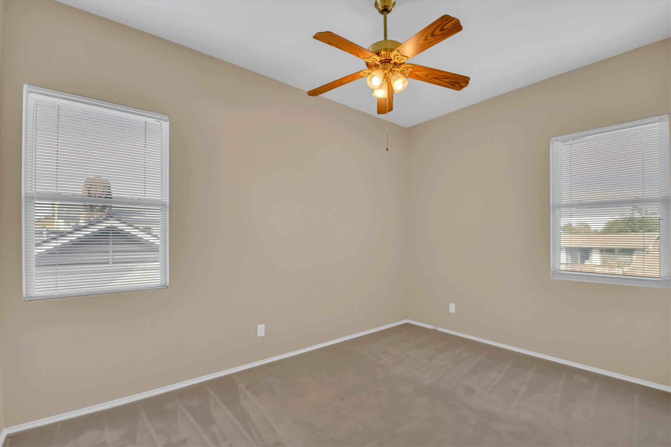 8108 Matchlock Cove Austin, TX 78729 - Photo 33 of 40 Spare room featuring carpet floors and ceiling fan