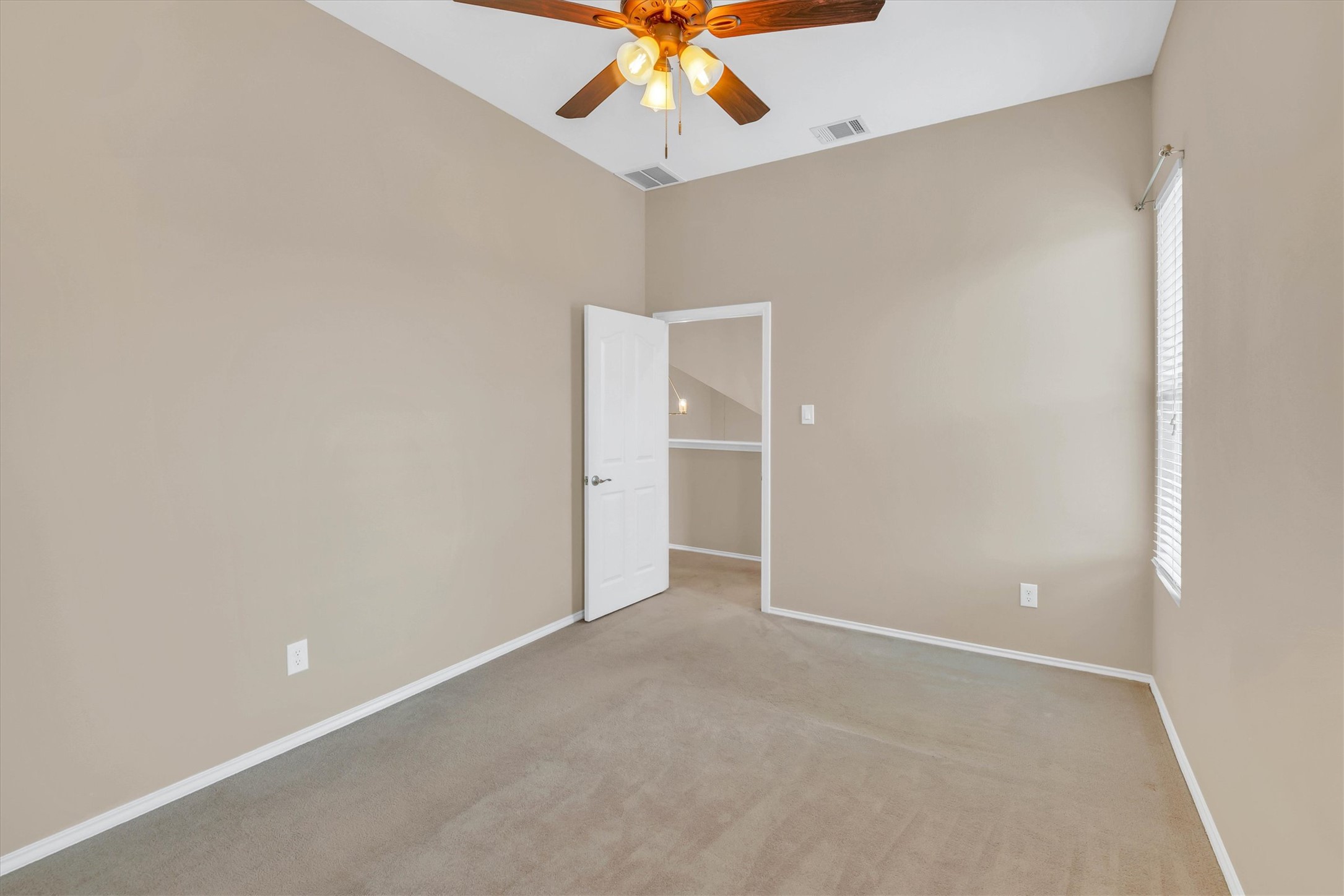 8108 Matchlock Cove Austin, TX 78729 - Photo 34 of 40 Unfurnished room with a ceiling fan and carpet flooring