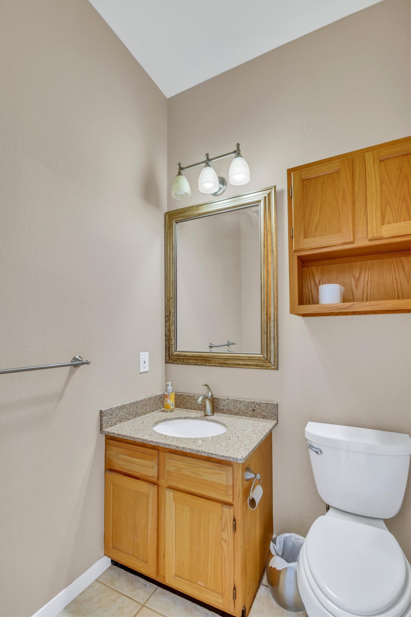 8108 Matchlock Cove Austin, TX 78729 - Photo 36 of 40 Half bath featuring vanity and light tile patterned floors
