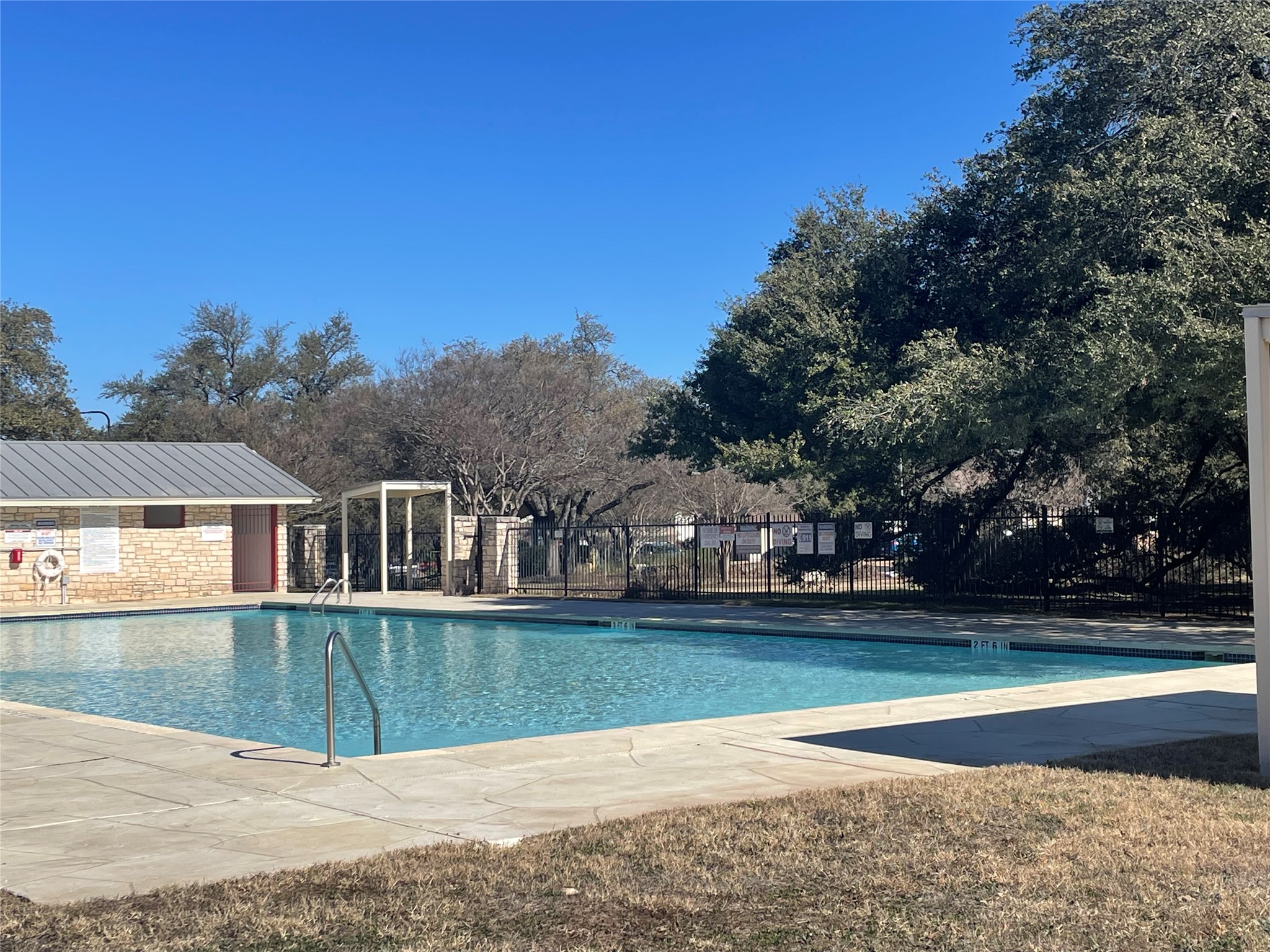 8108 Matchlock Cove Austin, TX 78729 - Photo 40 of 40 Community pool featuring a patio and an outdoor structure