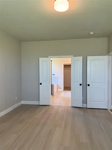a view of a livingroom with wooden floor