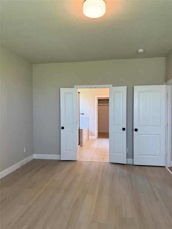 7308 Roaring Springs Road Arlington, TX 76002 - Photo 16 of 29 a view of a livingroom with wooden floor