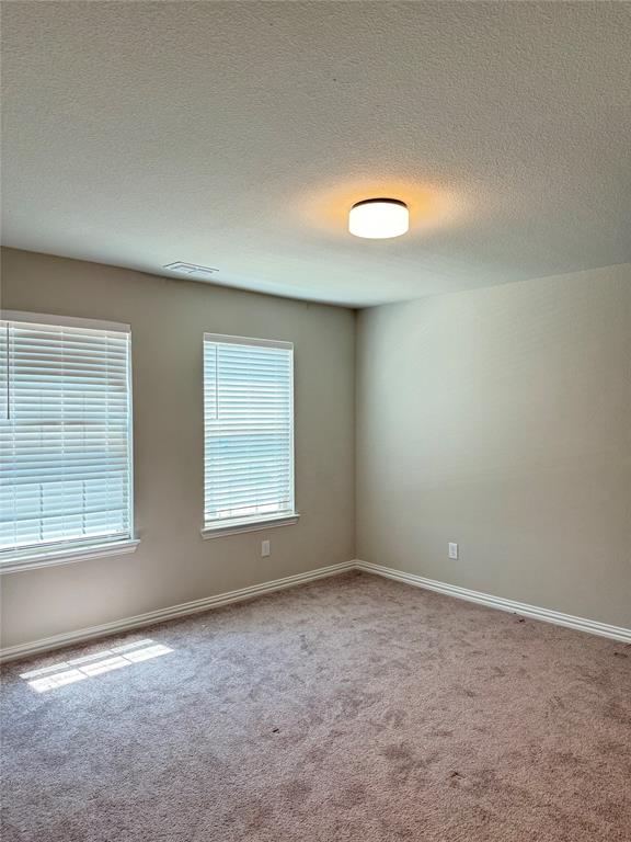 7308 Roaring Springs Road Arlington, TX 76002 - Photo 26 of 29 an empty room with a window
