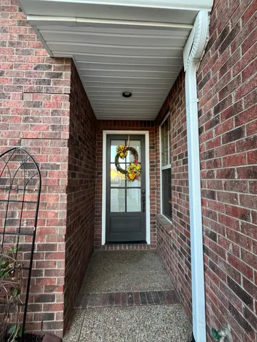 a front view of a house with a large window