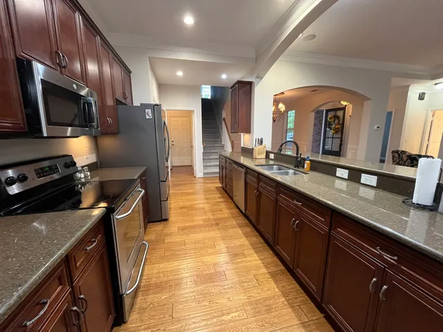 a large kitchen with stainless steel appliances