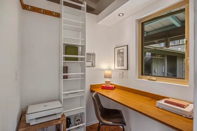 a room with a bed and a window