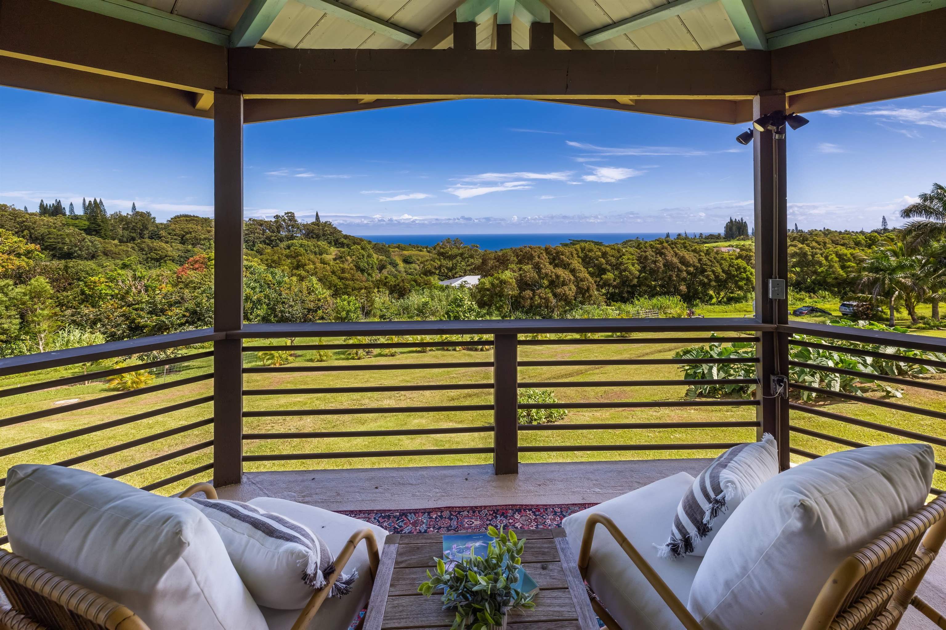 41 Leleaka Place, Unit A Haiku, HI 96708 - Photo 21 of 40 a view of a balcony with chairs