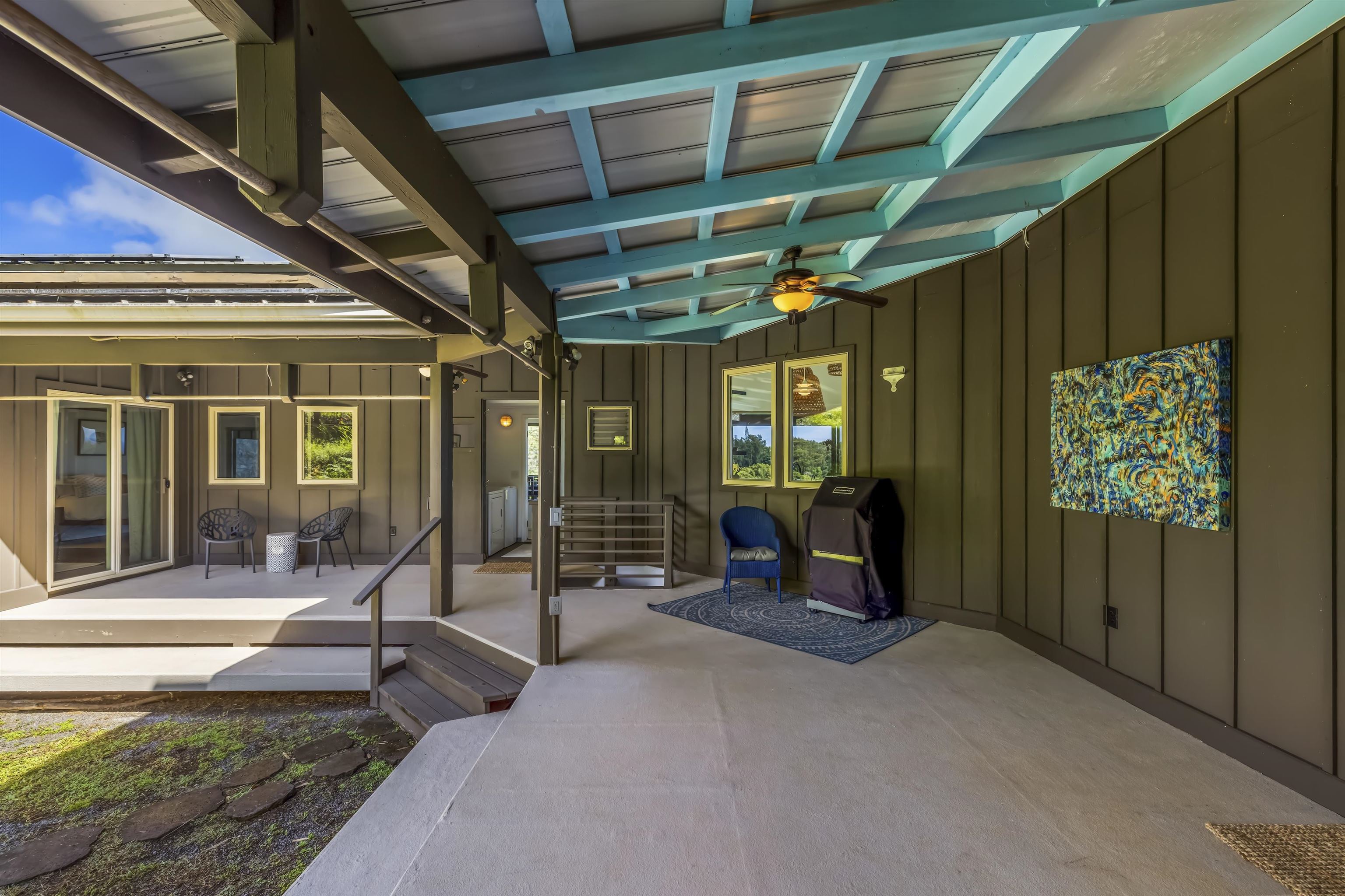 41 Leleaka Place, Unit A Haiku, HI 96708 - Photo 29 of 40 a view of a porch with chairs and floor to ceiling window