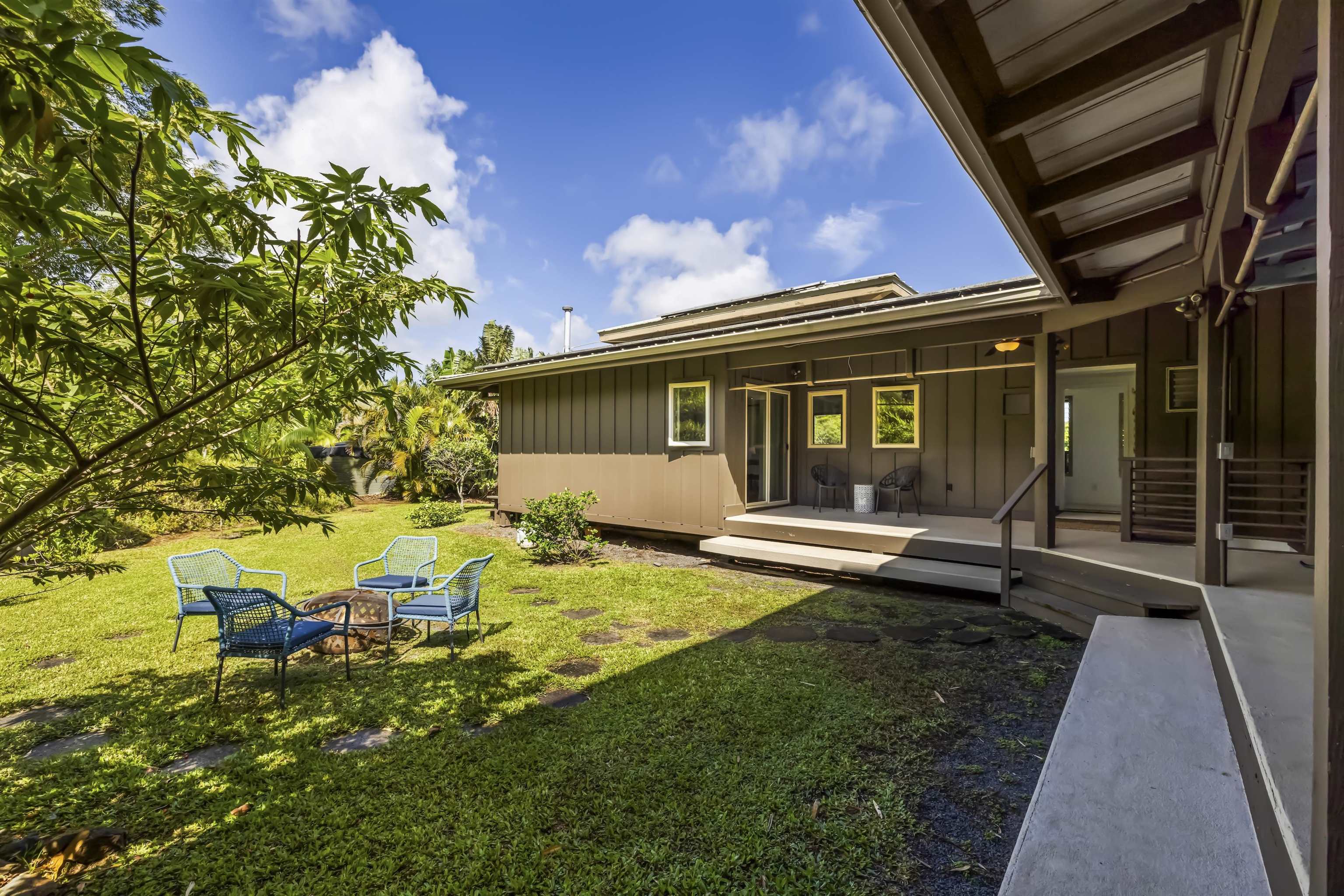 41 Leleaka Place, Unit A Haiku, HI 96708 - Photo 30 of 40 a view of a house with backyard sitting area and garden