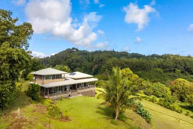a view of a lake with a house in the background