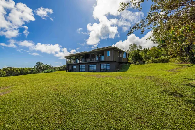 a view of a big room with table and chairs