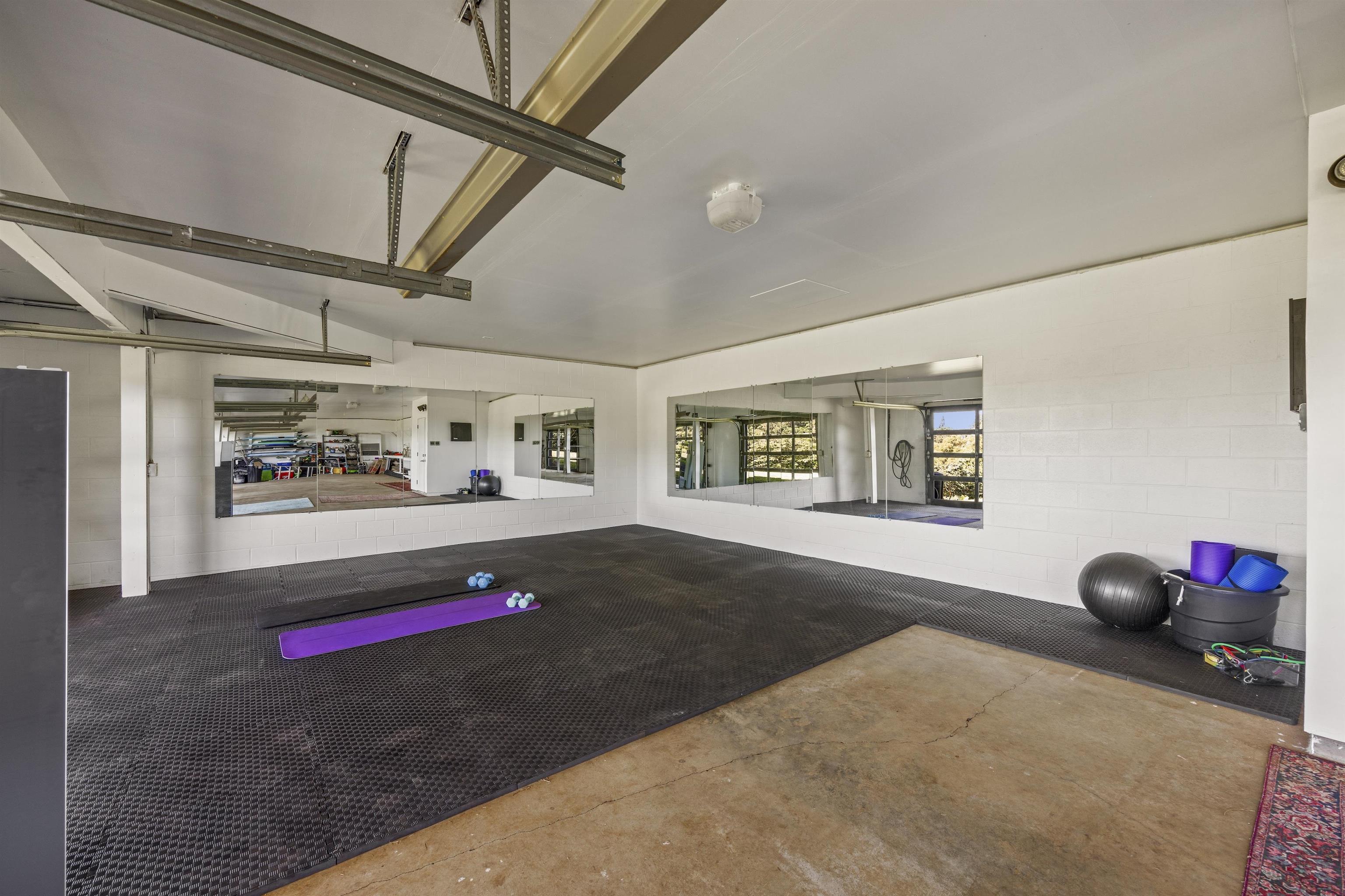 41 Leleaka Place, Unit A Haiku, HI 96708 - Photo 35 of 40 a view of a room with stairs and a painting on the wall