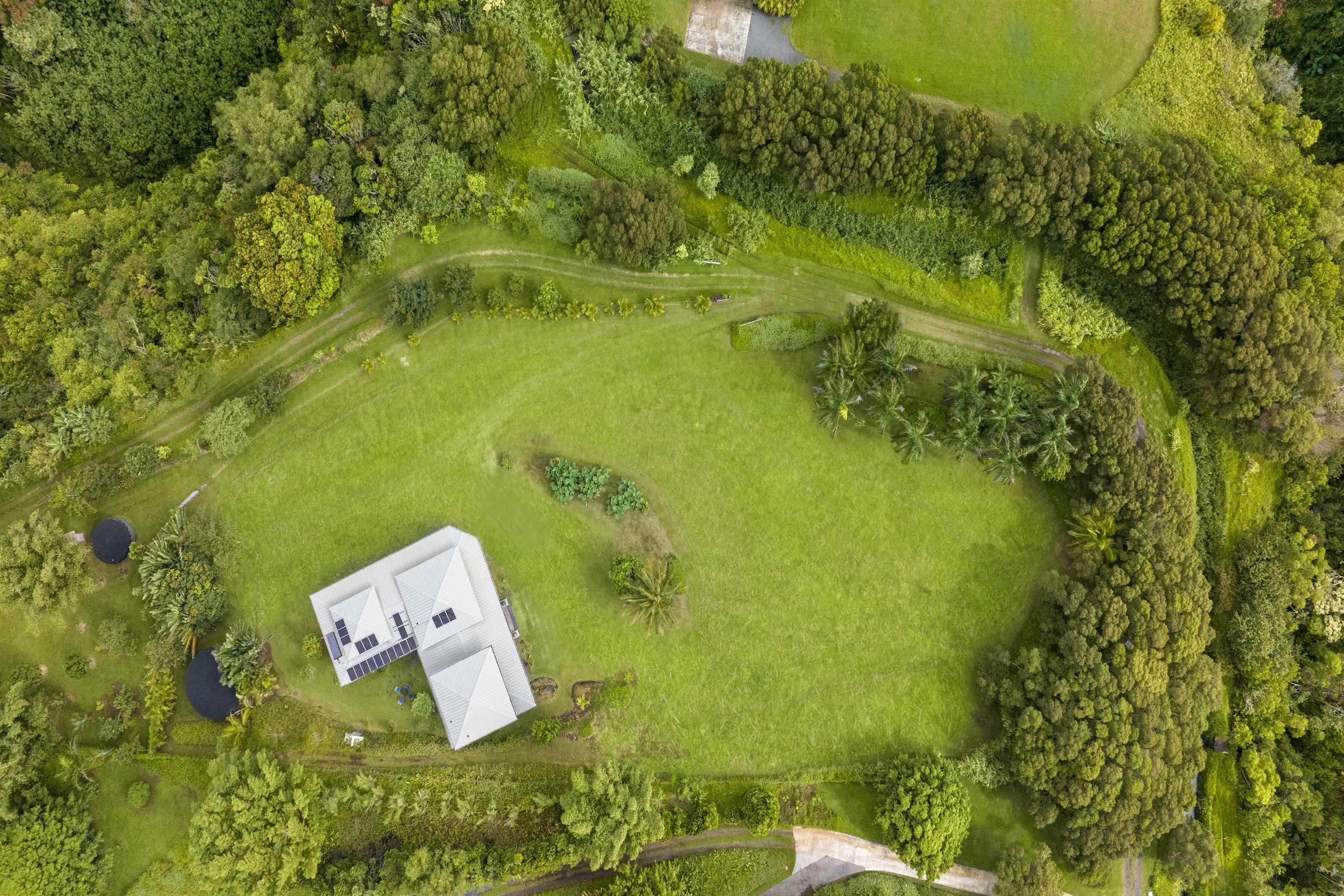 41 Leleaka Place, Unit A Haiku, HI 96708 - Photo 38 of 40 a view of a lake with a yard