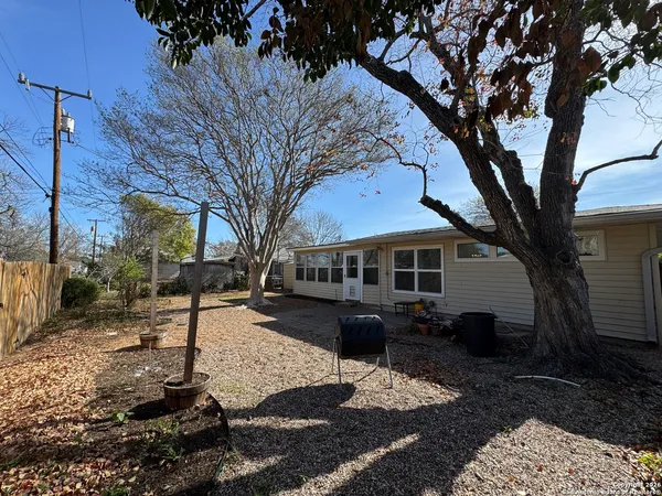 a view of a yard with trees