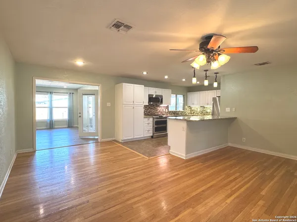 a view of a kitchen with a sink and cabinet