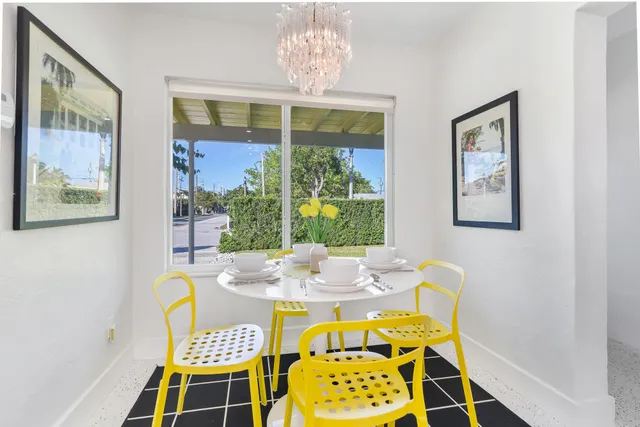 a dining room with furniture and window