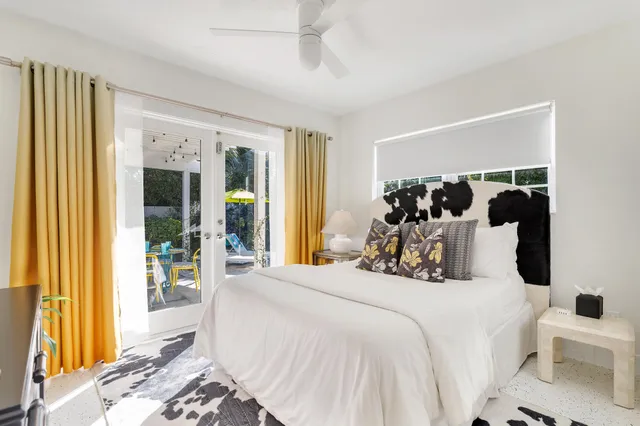 a bedroom with a large bed and a window