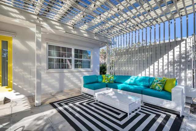 a view of a backyard with sitting area
