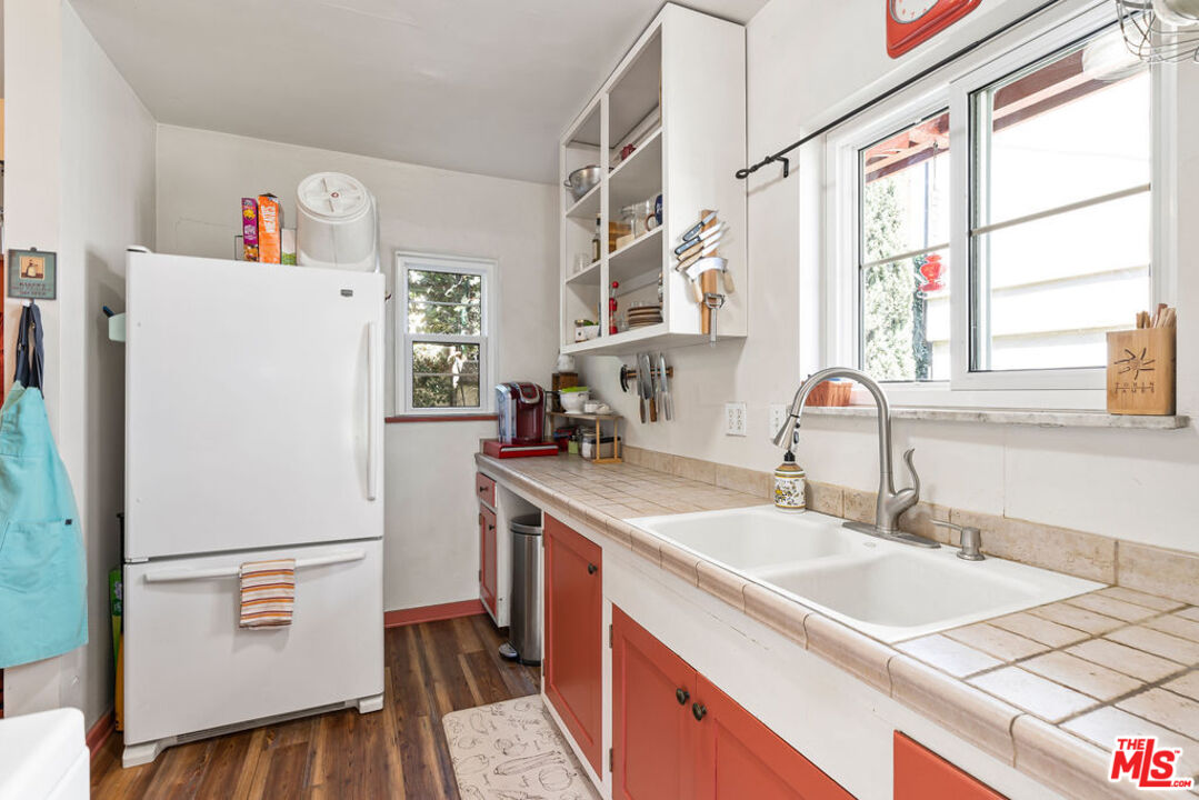 2403 Hyperion Avenue Los Angeles, CA 90027 - Photo 2 of 53 a utility room with cabinets washer and dryer