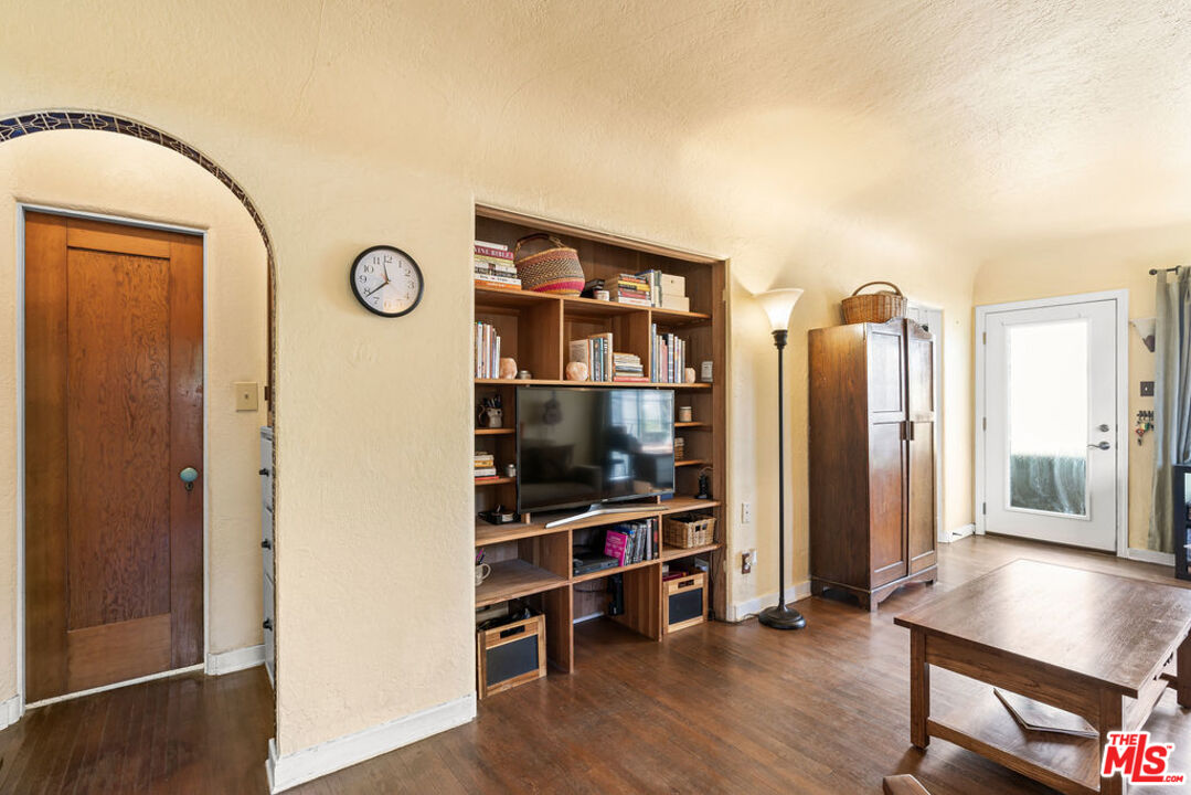 2403 Hyperion Avenue Los Angeles, CA 90027 - Photo 12 of 53 a view of a room with wooden floor and cabinet