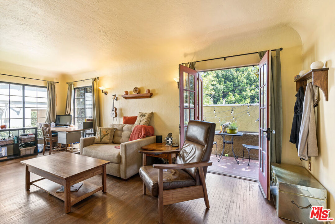 2403 Hyperion Avenue Los Angeles, CA 90027 - Photo 13 of 53 a living room with furniture a large window with outer view