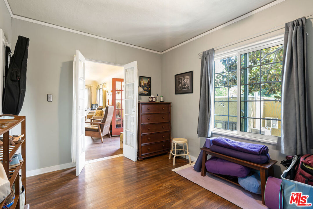 2403 Hyperion Avenue Los Angeles, CA 90027 - Photo 24 of 53 a living room with furniture a flat screen tv and a window