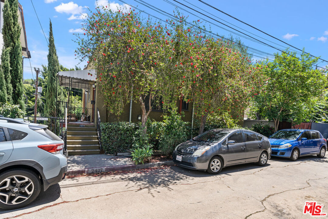 2403 Hyperion Avenue Los Angeles, CA 90027 - Photo 28 of 53 a car parked in front of a house