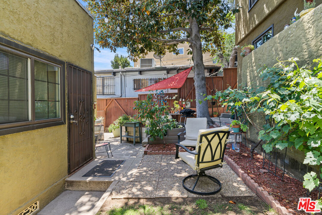 2403 Hyperion Avenue Los Angeles, CA 90027 - Photo 32 of 53 a view of a chair and table in backyard