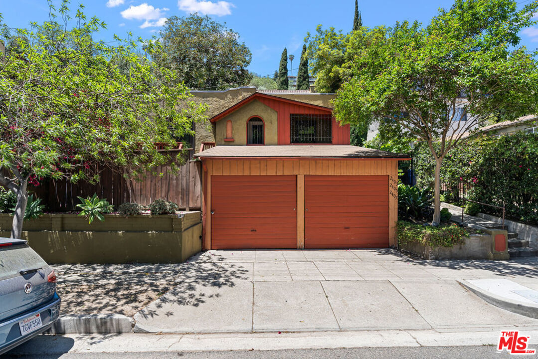 2403 Hyperion Avenue Los Angeles, CA 90027 - Photo 53 of 53 a front view of a house with a garden