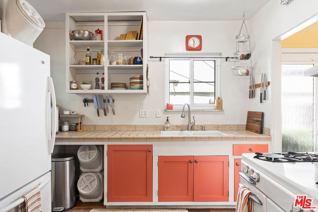 2403 Hyperion Avenue Los Angeles, CA 90027 - Photo 7 of 53 a kitchen with stainless steel appliances granite countertop a sink and a window