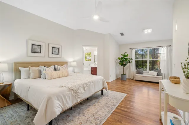 a bedroom with a large bed and a couch