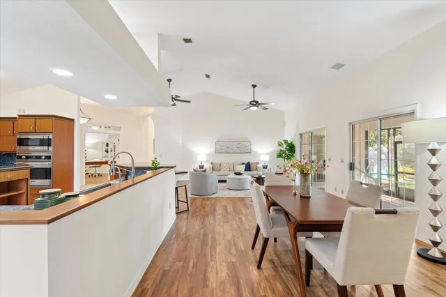 a large kitchen with a table and chairs