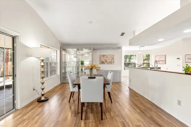 a view of a dining room with furniture window and wooden floor