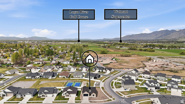 401 West 3085 South, Unit 329 Nibley, UT 84321 - Photo 7 of 34 Aerial perspective of suburban area featuring mountains
