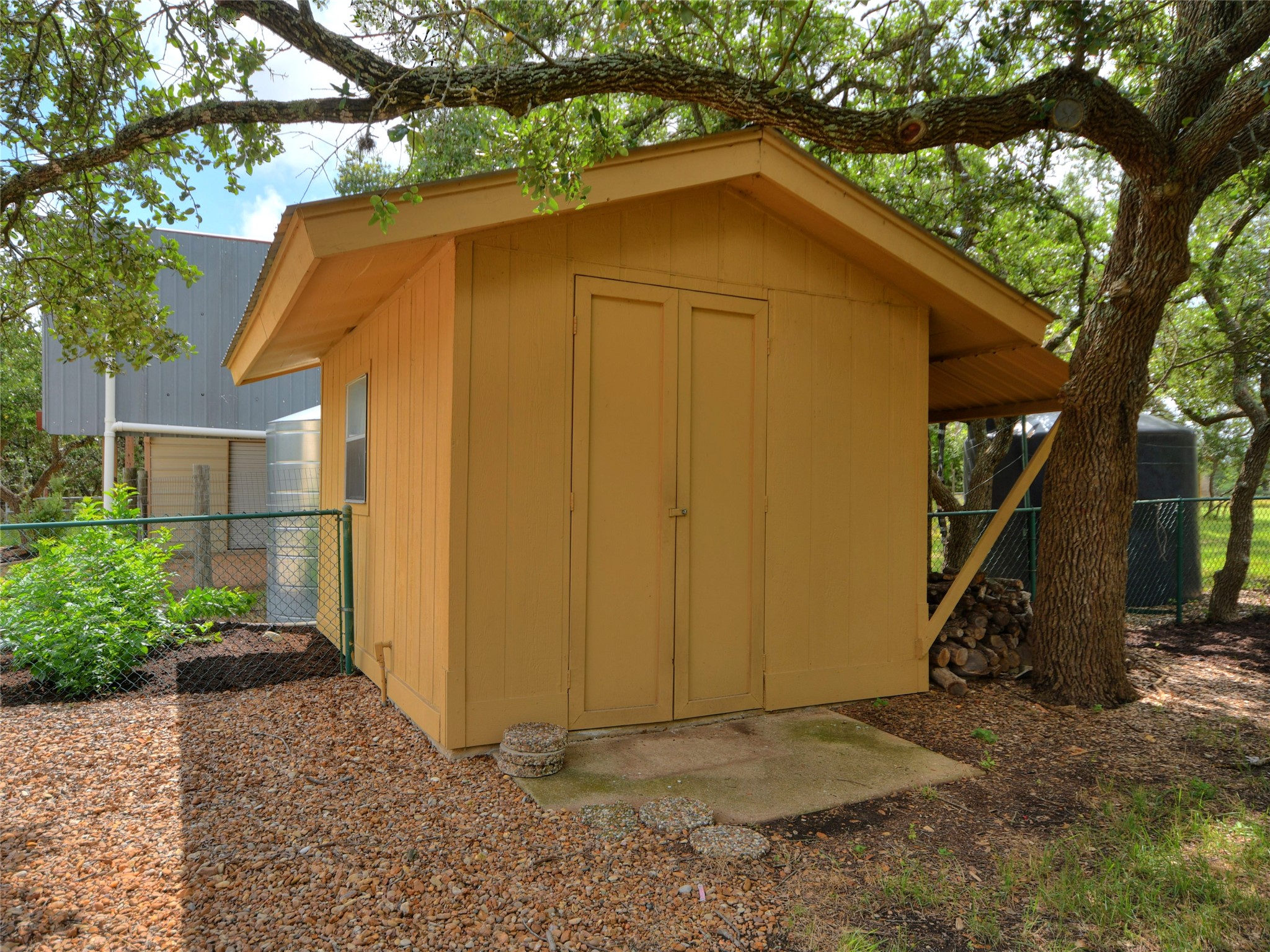 328 Fawnridge Street Georgetown, TX 78628 - Photo 27 of 33 Large garden shed located in backyard - perfect for yard tools such as lawnmower, garden supplies etc.
