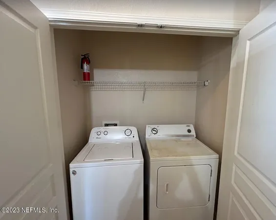 a utility room with dryer and washer