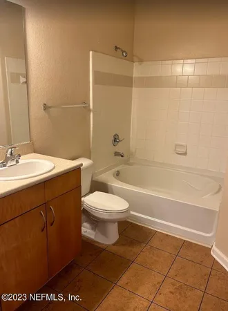 a bathroom with a sink a toilet and a bathtub