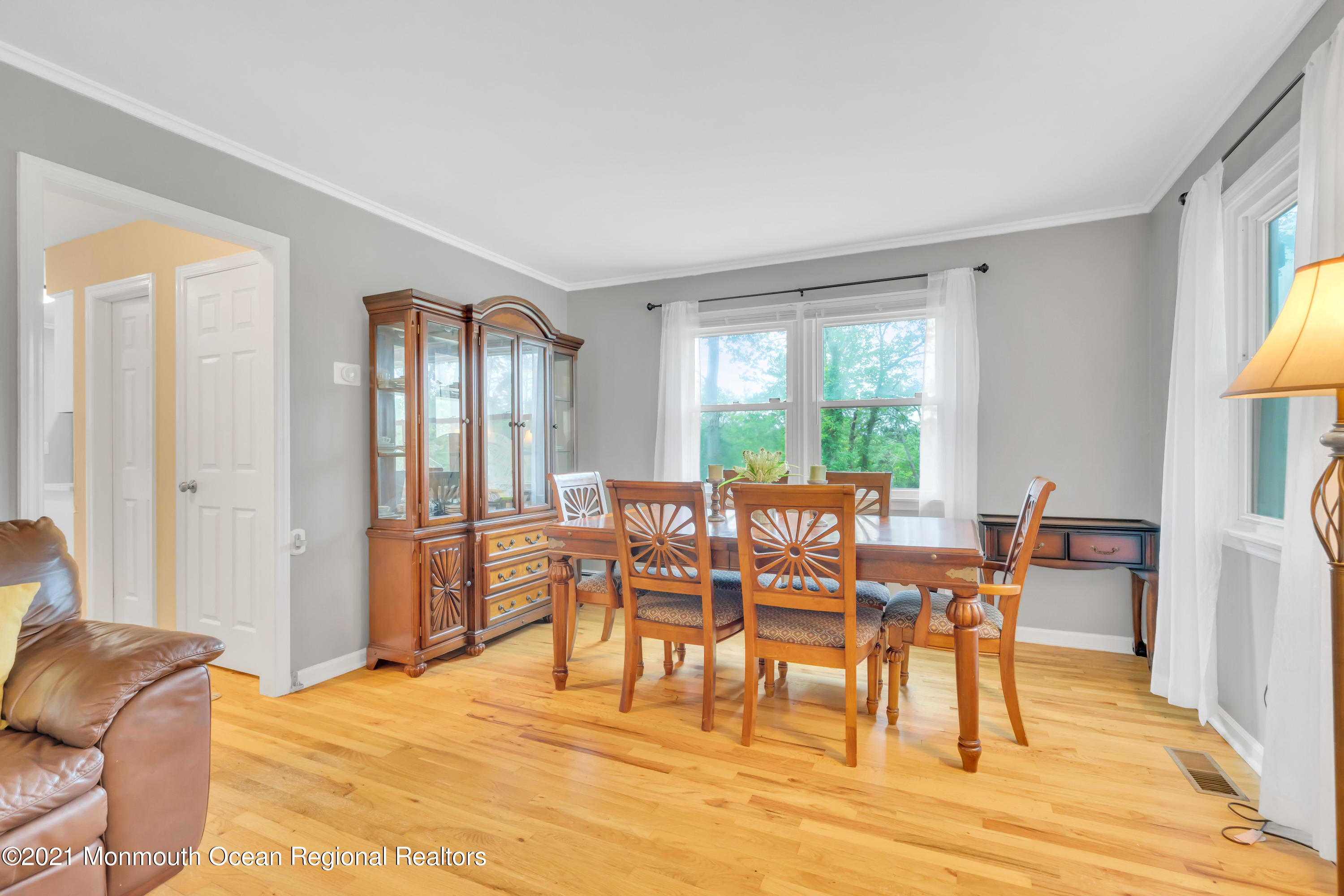 1675 Forge Pond Road Brick, NJ 08724 - Photo 12 of 69 a view of a a dining room with furniture window and wooden floor
