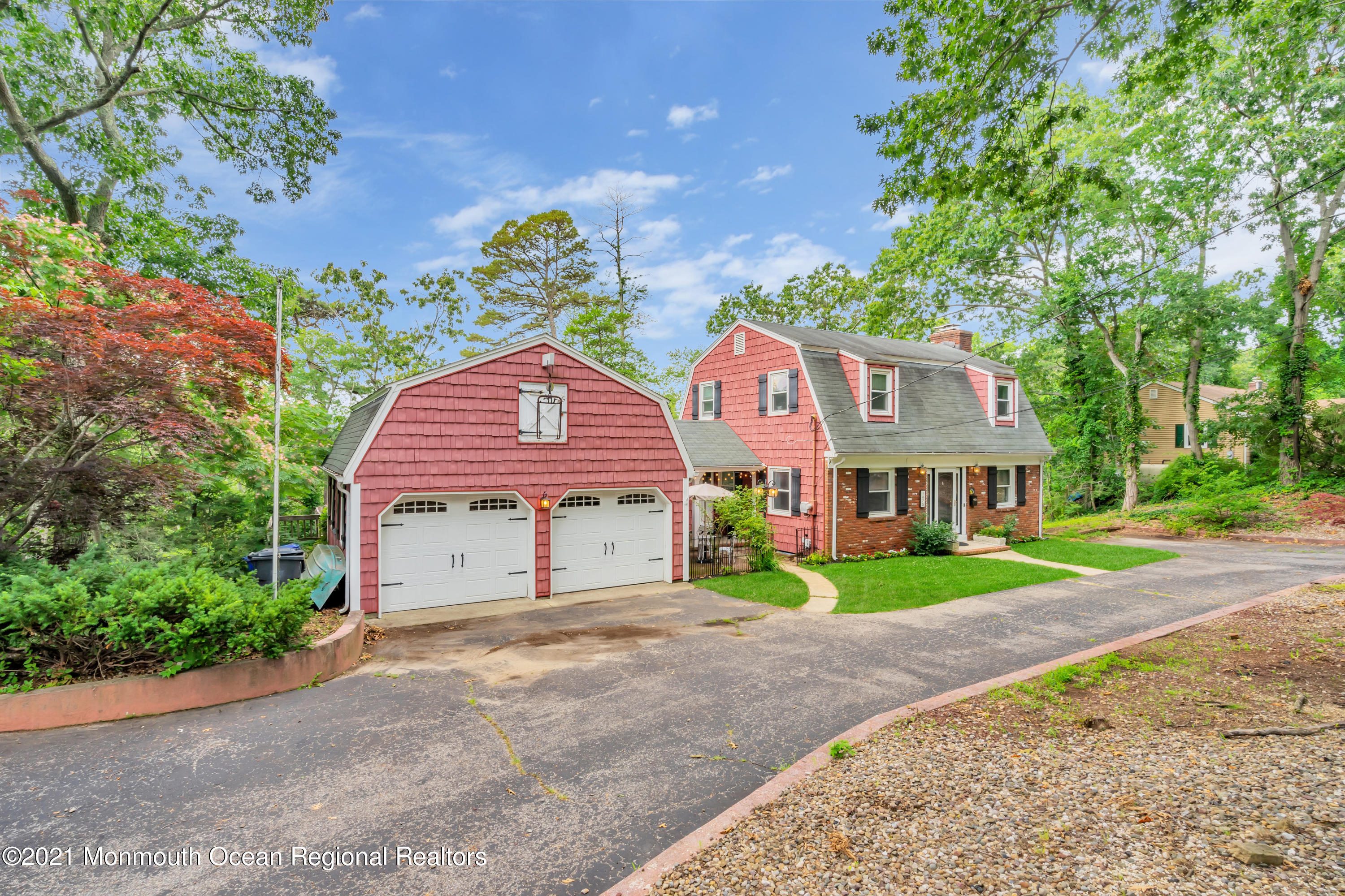 1675 Forge Pond Road Brick, NJ 08724 - Photo 3 of 69 a front view of a house with a yard and garage
