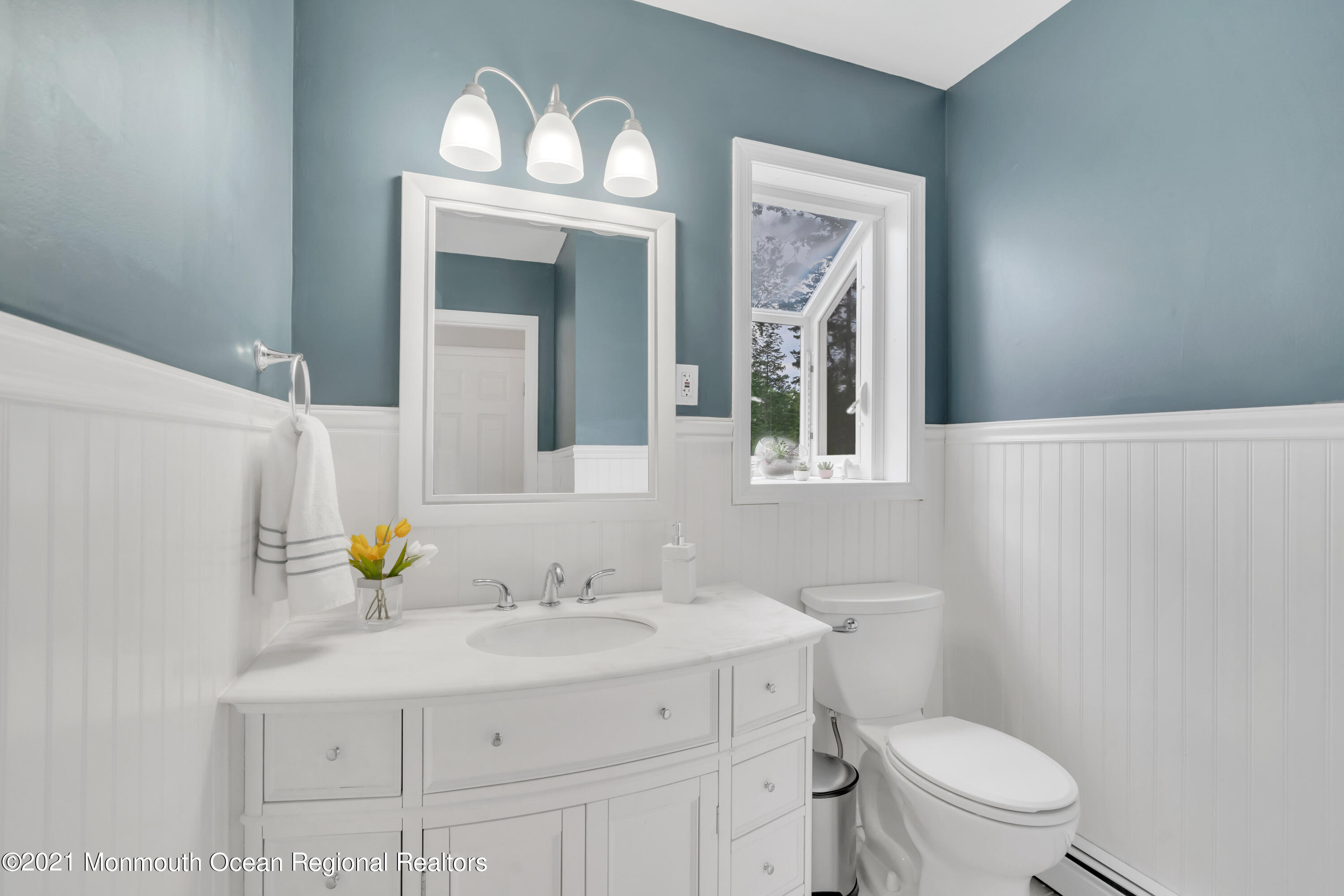 1675 Forge Pond Road Brick, NJ 08724 - Photo 25 of 69 a bathroom with a toilet a sink and a mirror