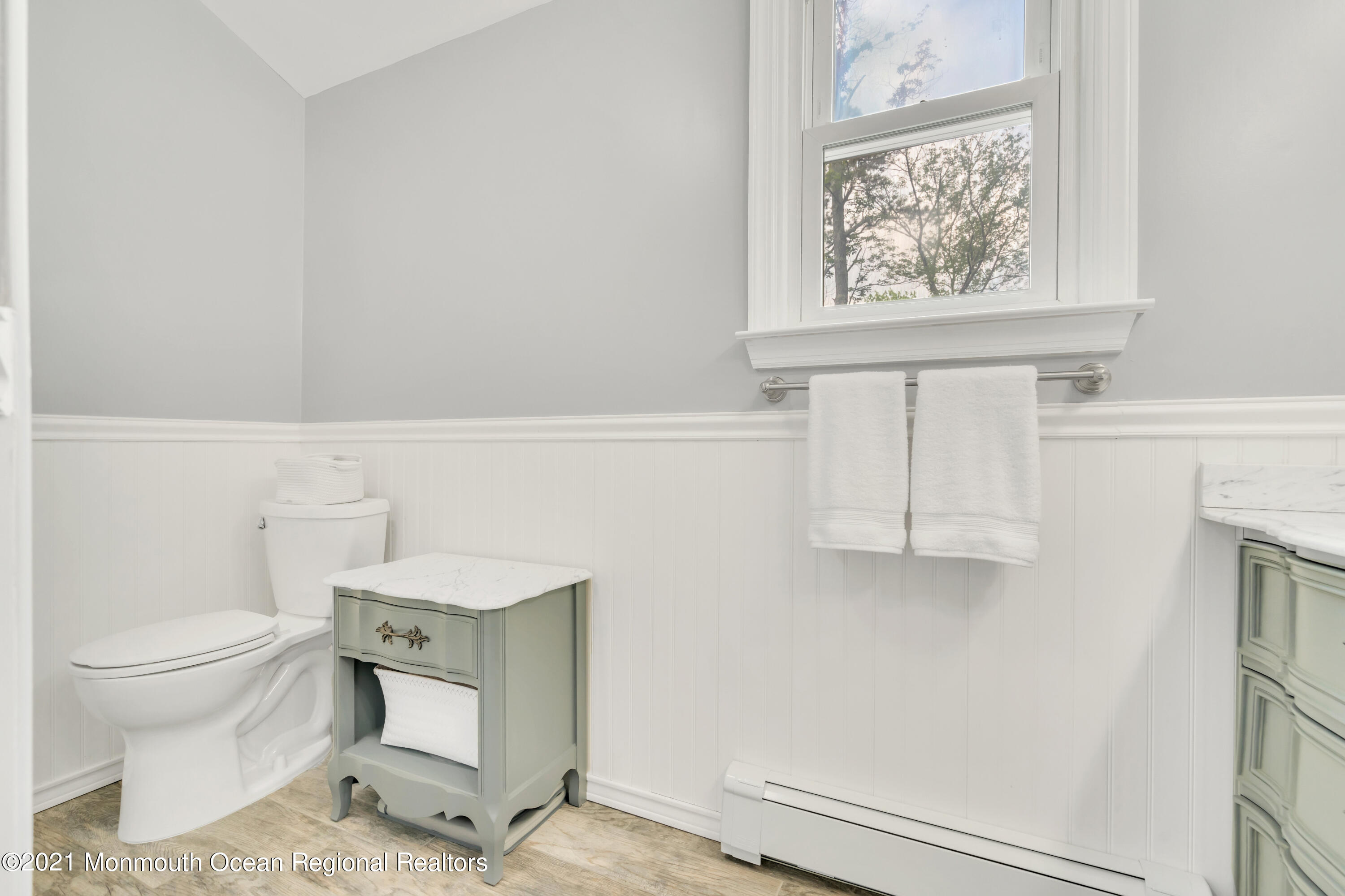 1675 Forge Pond Road Brick, NJ 08724 - Photo 31 of 69 a bathroom with a toilet a sink and a window