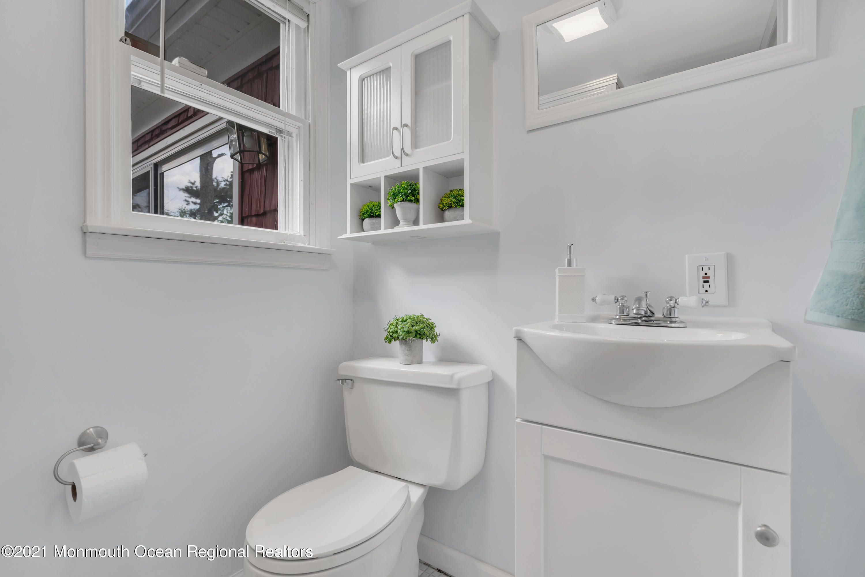1675 Forge Pond Road Brick, NJ 08724 - Photo 45 of 69 a bathroom with a sink mirror and toilet